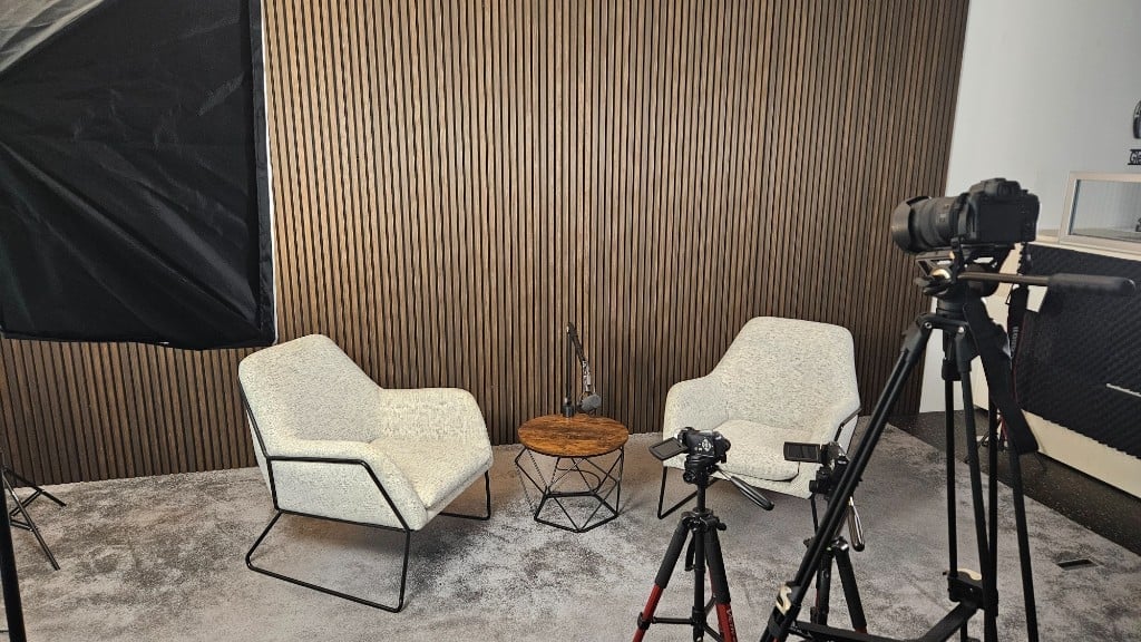 Interview setup with multiple cameras, softbox and boom microphone